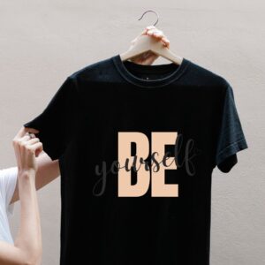 Black women’s t-shirt with “Be Yourself” printed in light peach – soft and breathable summer cotton tee